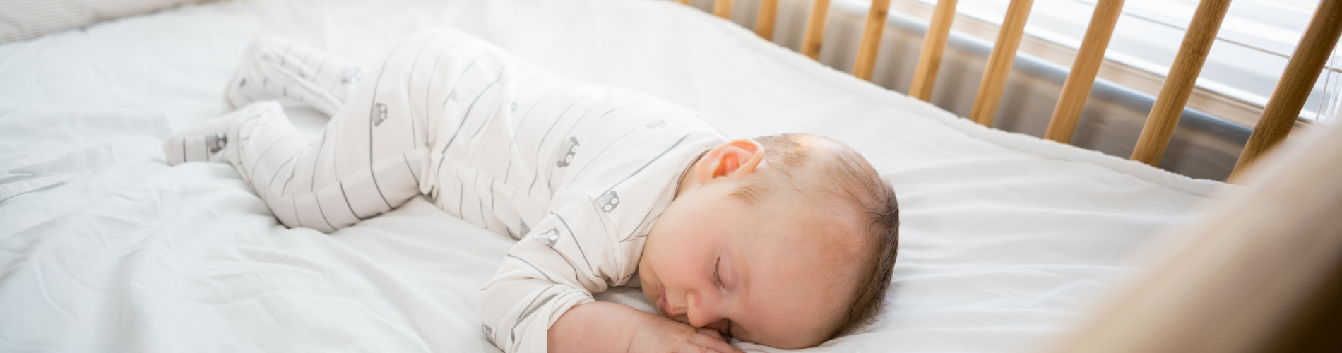 sleeping baby a baby sleeping on a bed